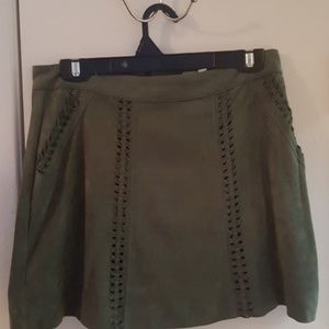 Green suede skirt.
